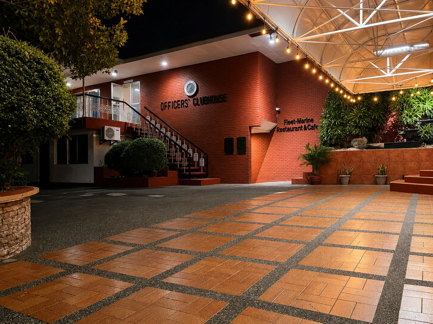 The warmly lit entrance of the Philippine Navy Officers’ Clubhouse