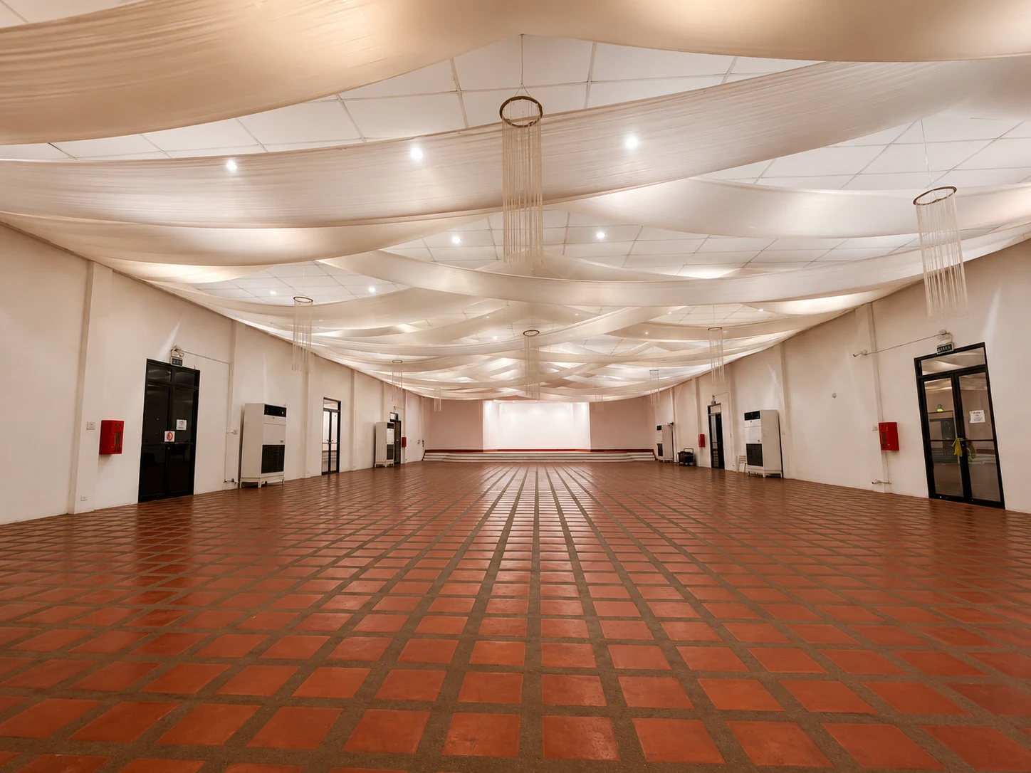 Social Hall with tiled floors and a raised stage